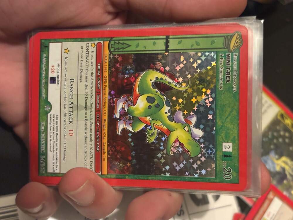 MetaZoo Mini T-Rex 14/165 UFO First Edition Holographic Card